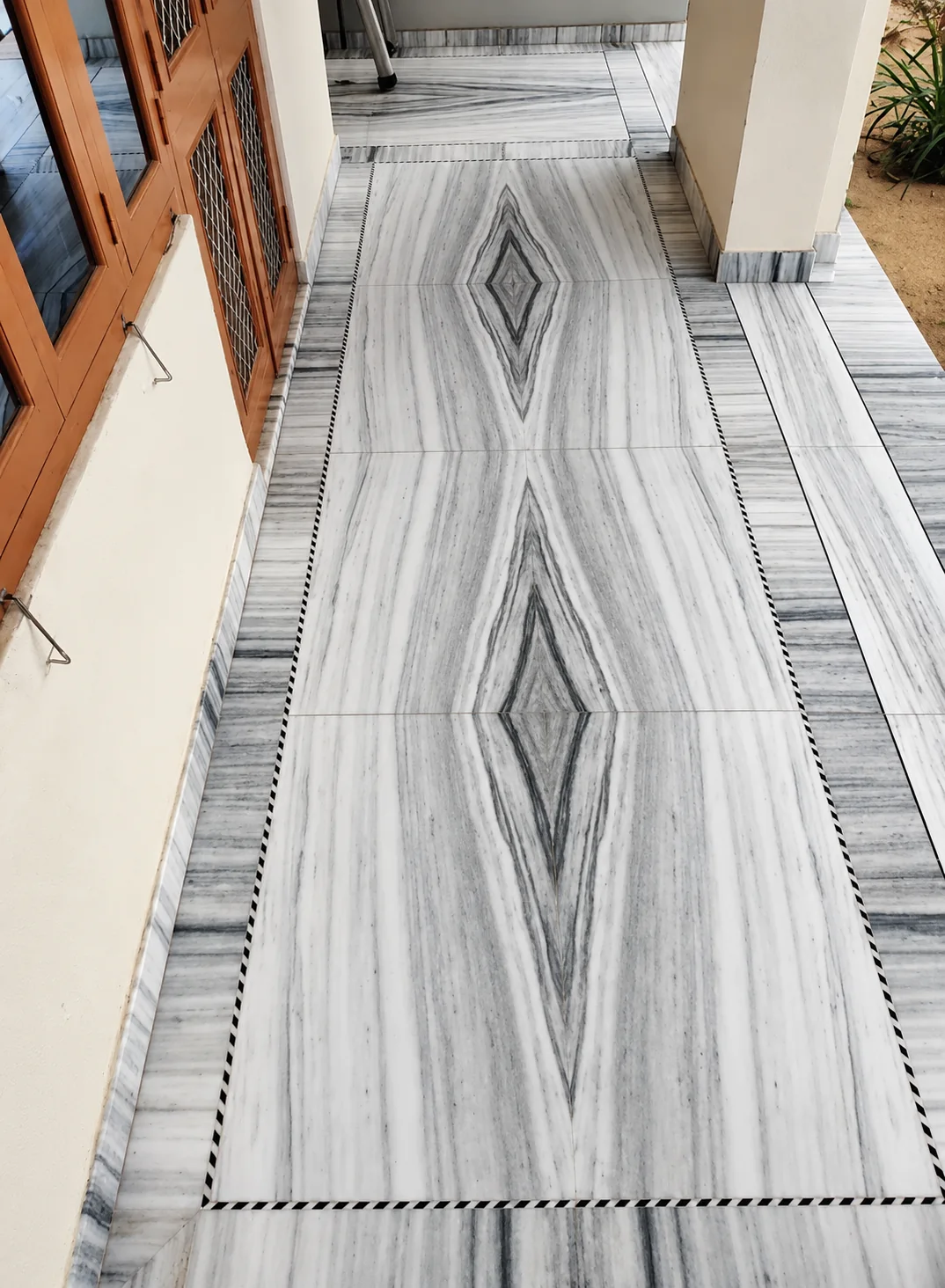 Bookmatched marble entrance floor photographed by Geeta Marble Construction