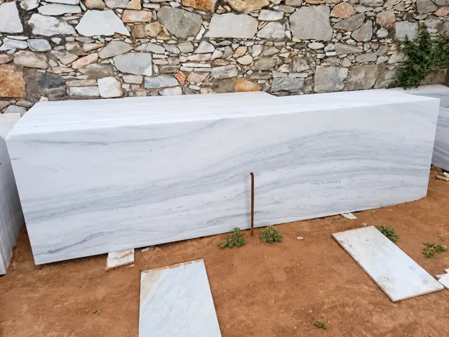 Long light marble slabs with subtle grey bands — enhanced business photograph