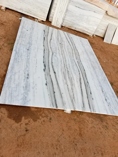 Grey-veined marble pieces arranged together — enhanced business photograph
