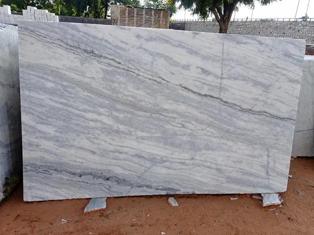Grey marble slab with layered diagonal veining — enhanced business photograph