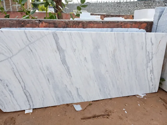 White marble slab with long natural grey veins — enhanced business photograph