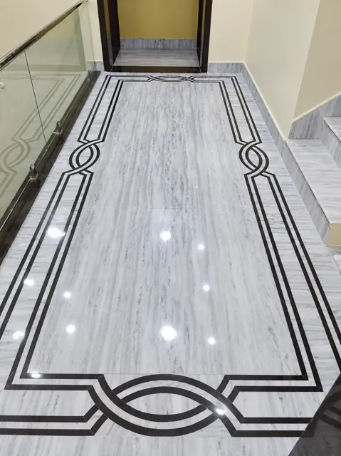 Fitted marble corridor with decorative border — enhanced business photograph