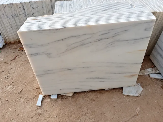 Light marble tiles stacked in the yard — enhanced business photograph